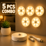 Five LED night lights with a power adapter and USB cable on a surface.